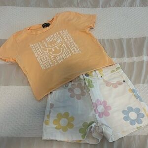 Floral white Jean shorts and Have a Howdy Day graphic smiley melon orange tshirt